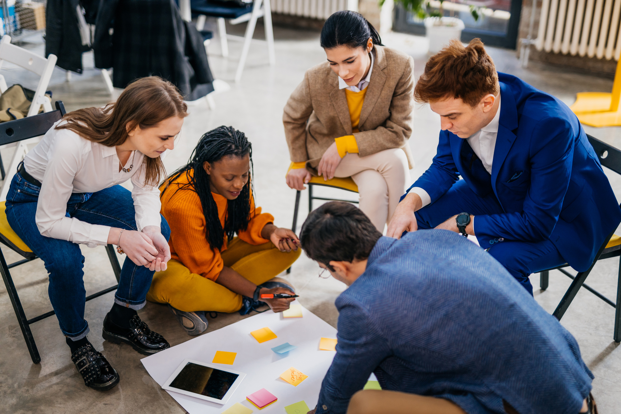 Colleagues collaborating on ideas around a table